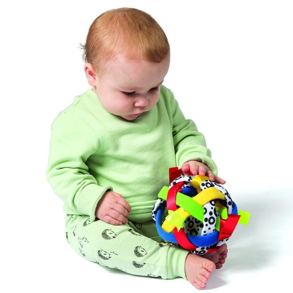 Scene of a baby playing with the Bababall.