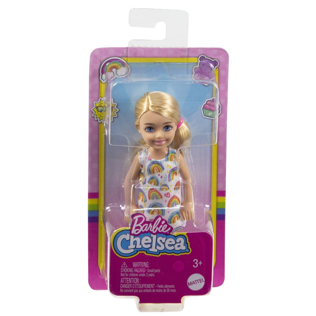Image of the packaging for Chelsea Doll in Rainbow Print Dress. The front is made from clear plastic so you can see the doll inside.