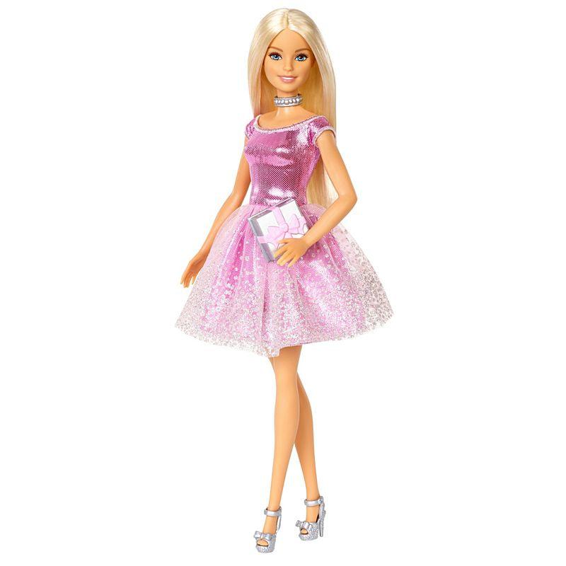 Image of Barbie outside of the packaging. She is wearing a beautiful sparkly pink dress and silver high heels. She comes with a silver and pink birthday gift.