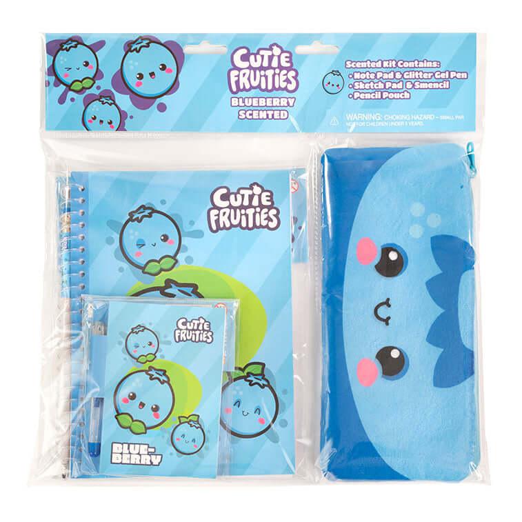 Image of the Blueberry Cutie Fruities Stationary Kit. Comes with a blueberry themed notepad, glitter gel pen, sketch pad, smencil, and pencil pouch. Each blueberry face has little pink blushies under their eyes.