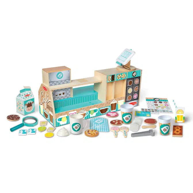 Image of the put together store and all of the included parts. The store is mainly blue and brown. The set includes many different pastries, coffee cups, utensils, cooking ingredients, and more!