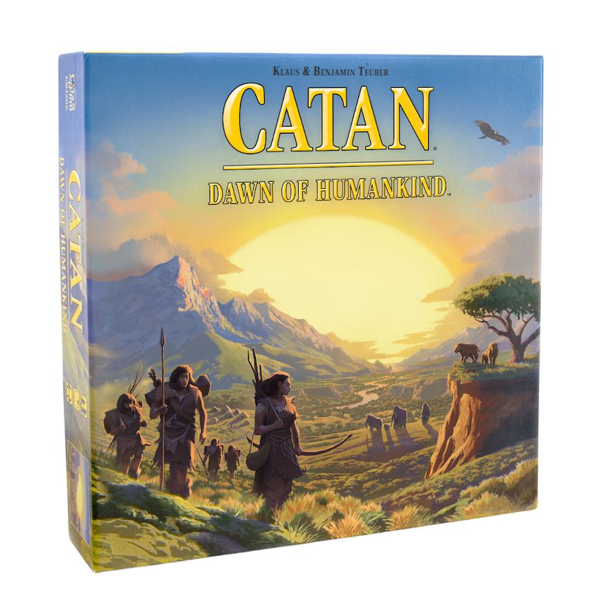 Image of the box for the game Catan: Dawn of Humankind. On the front is a scene of people dressed in animal skins and holding spears trekking across a valley surrounded by mountains.