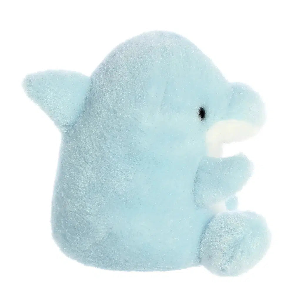 Side view of the dolphin plush. From this angle you can see that there is a dorsal fin on her back.
