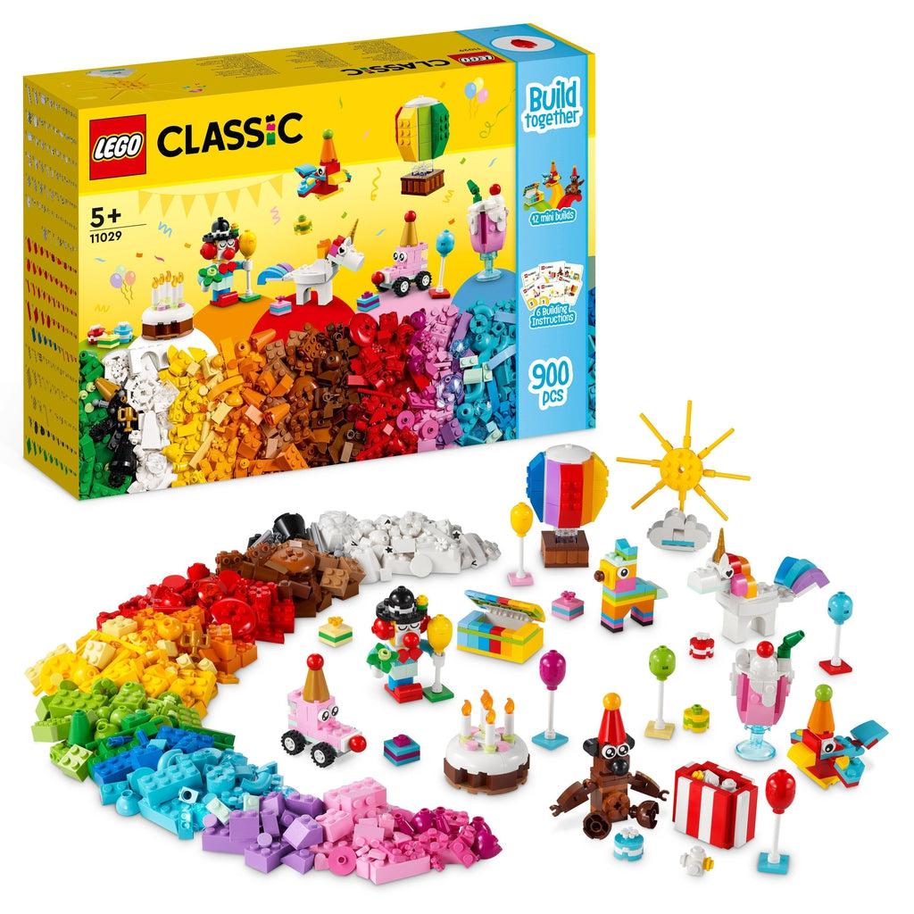Image of the front of the box. It shows a sorted rainbow pile of LEGO bricks with built creations coming out of the colors.