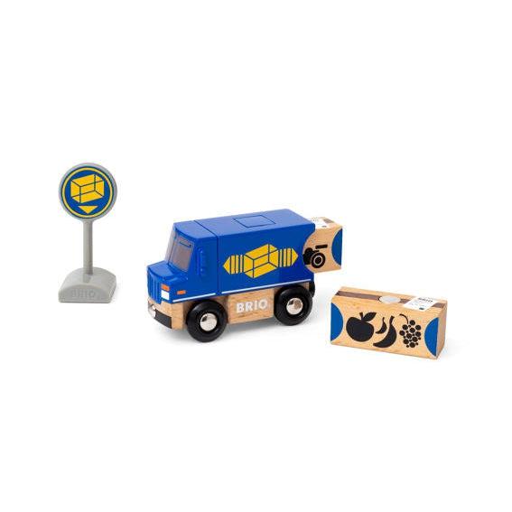 Image of the play set outside of the packaging. It comes with a blue delivery truck with a yellow package symbol, a package delivery sign, and two different packages.