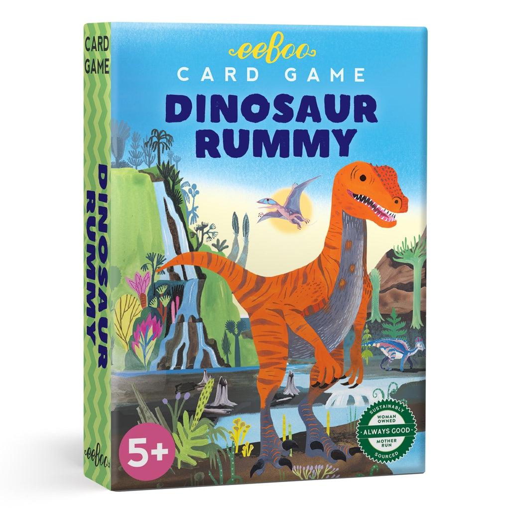 This image shows the dinosaur rummy card game. a dinosaur is front and center in this prehistoric earth background for the card set, full of vibrant colors for the classic game of rummy