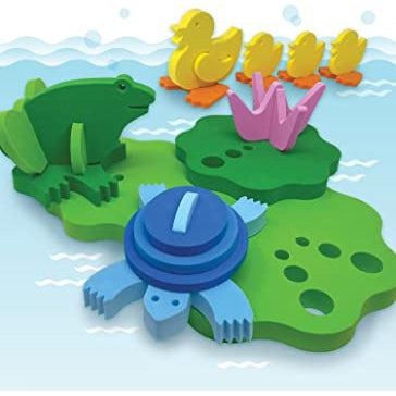 Image of all the included 3D puzzle pieces. The toy comes with floating lily pads, frog, blue turtle, and four yellow ducks.
