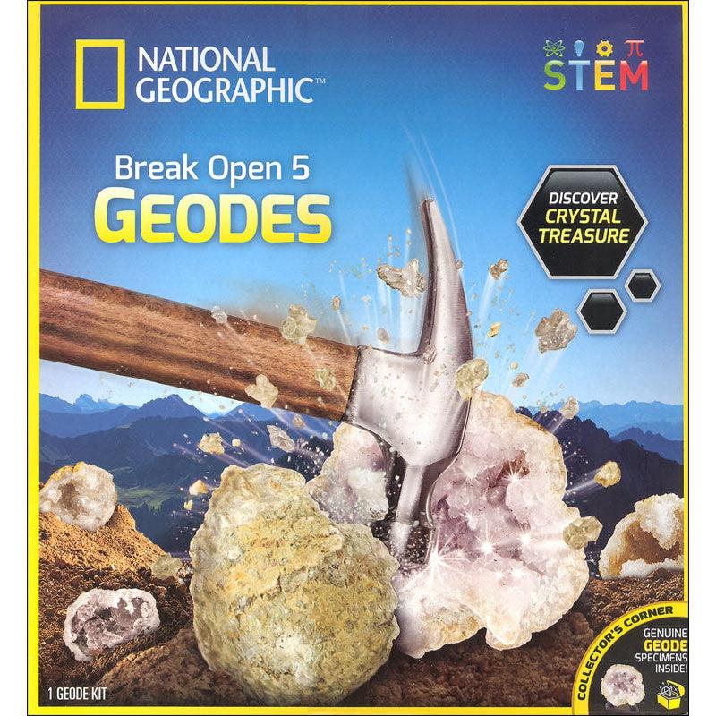 This image shows a hammer smashing open a rock to reveal the crystals hidden inside. there is text reading on the box taht says "Discover crystal treasure" and "genuine geode specimens inside" 