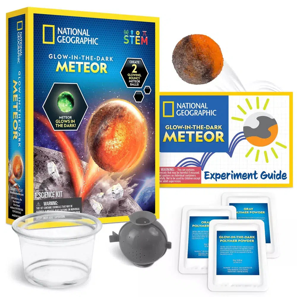 this image shows everything included in the box, the polymer powder to make a colored meteor, cup for water, mold, and an experiment guide. 