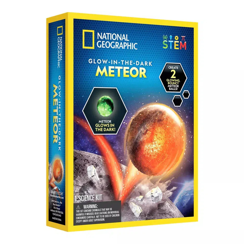 this image shows a picture of the box for the glow in the dark meteor. a bouncy ball meteor is rocketing off a planet in the picture with the caption "Create 2 glowing bouncy meteor balls!"