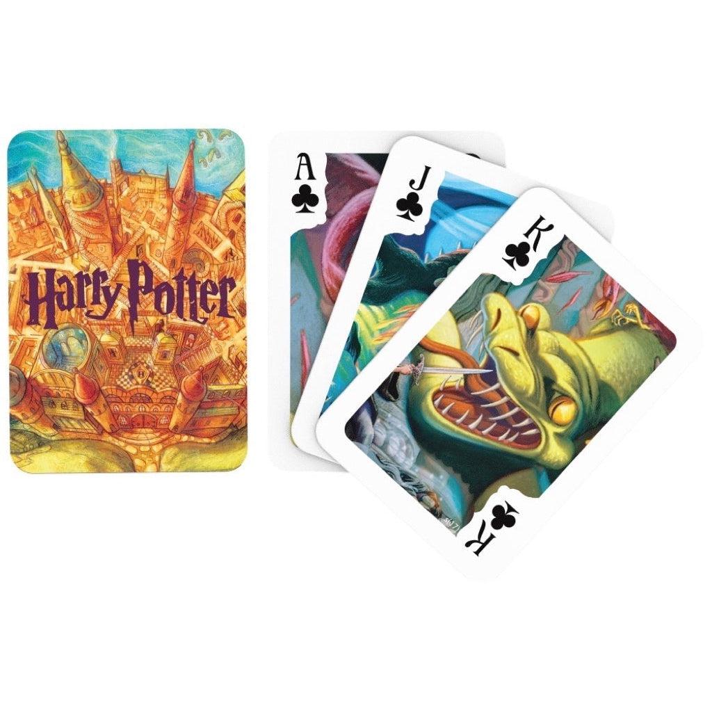 Image of the back of the deck of cards. On it is an illustration of a birds-eye view of Hogwarts.