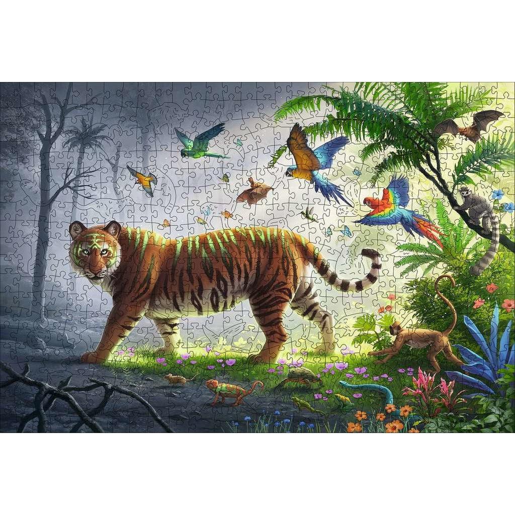 Image of the finshed puzzle. It is a scene of a jungle tiger walking from a lush jungle into a desolate, grey jungle.