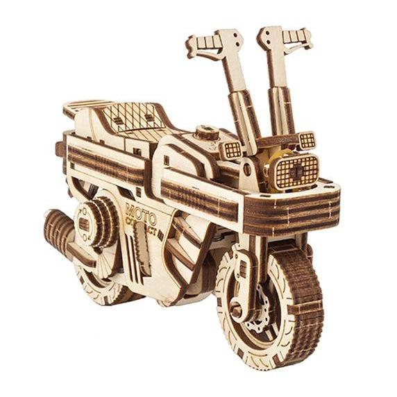Image of the Moto Compact Folding Scooter model. It is made from unpainted wood and it has lots of intricate detail on the seat, the lights, the wheels, and the gears.