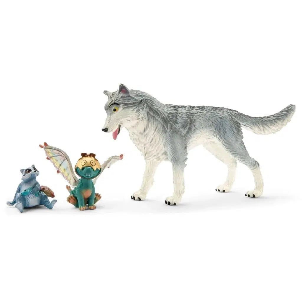 Image of the figurines outside of the packaging. It comes with a grey wolf, a raccoon, and a blue dragon.