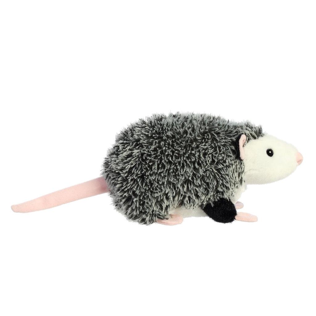 Side view of the opossum plush. From this angle you can see that his tail is almost as long as his body.