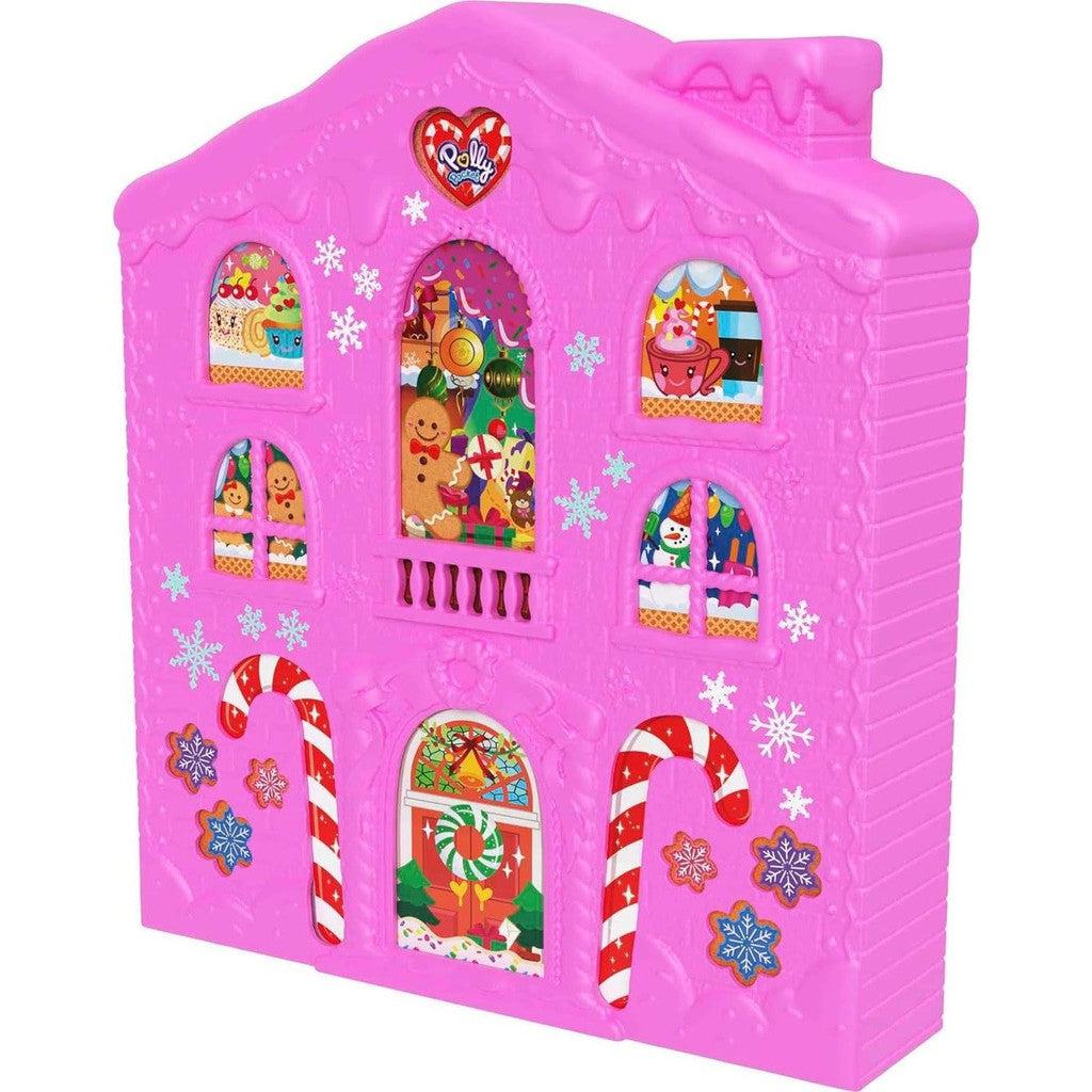 The closed front of the advent calendar is shown, it's bright pink with 6 windows (stickers) showing gingerbread characters and other holiday themed things inside