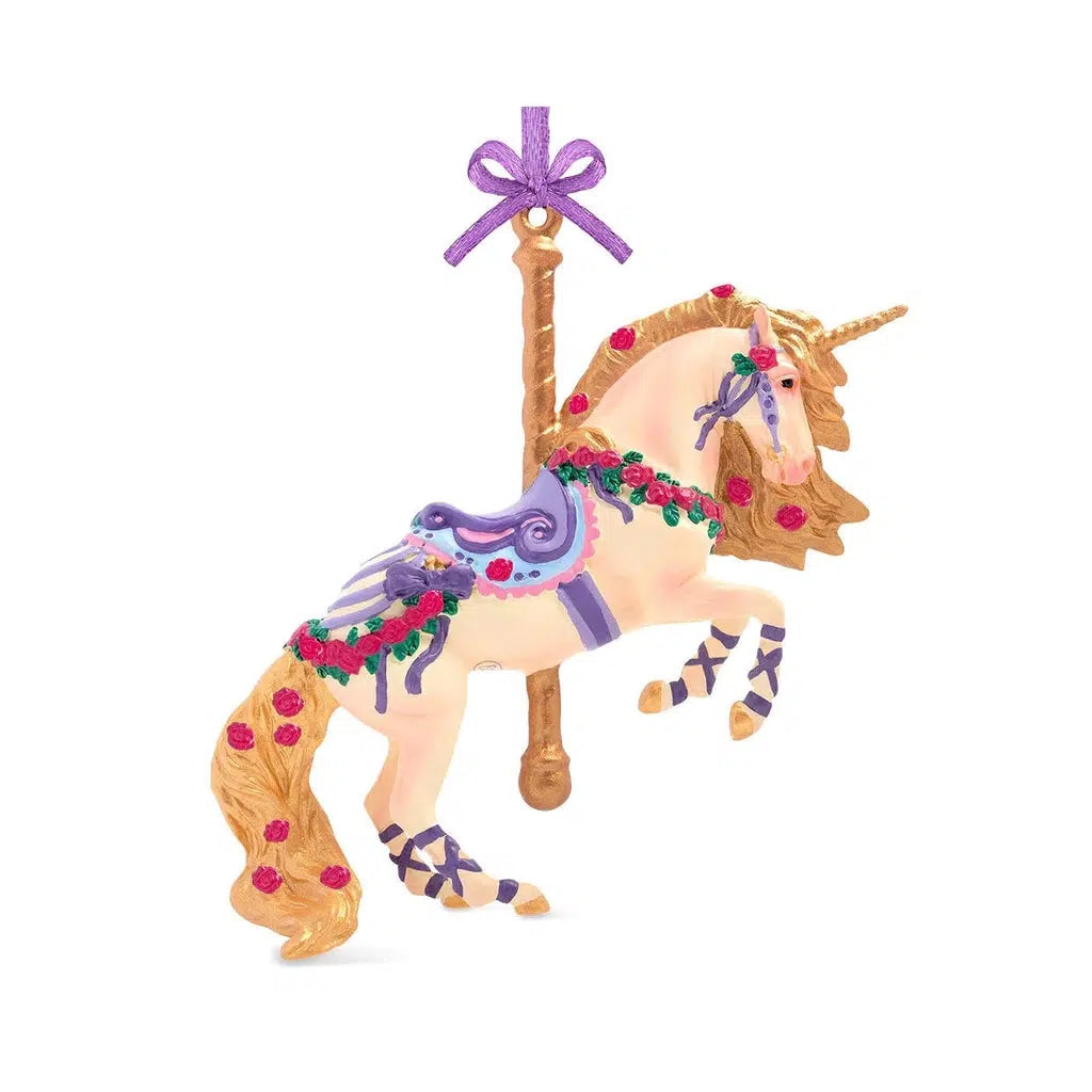 White carousel horse with a golden mane, tail, and pole. It has purple ribbons and saddle and there are roses as decoration throughout the ornament.