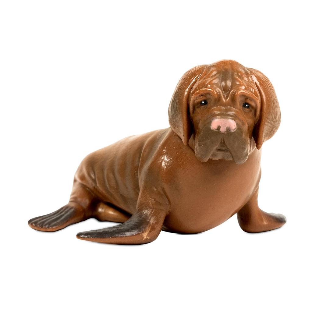 Image of the Sea Dog FIgure. It is a brown seal with the head of a droopy-faced dog.