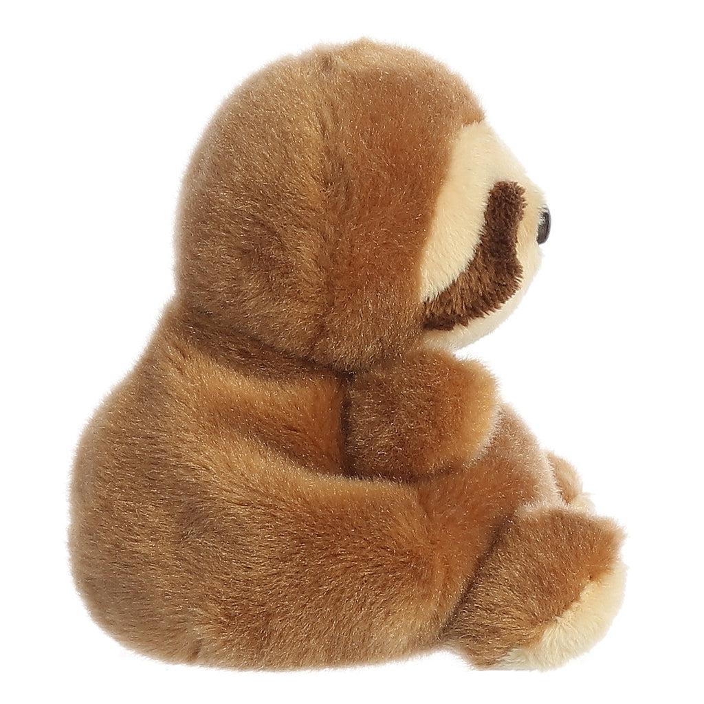 Side view of the sloth plush. He is in sitting position with his arms and feet out to the front.