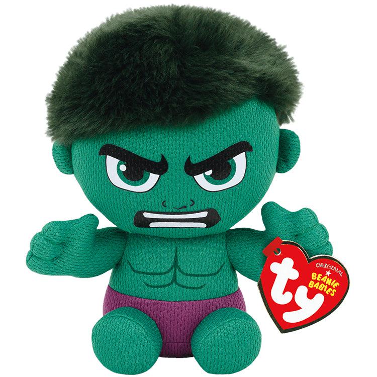 Image of the Small Hulk Doll. It is a cartoon version of hulk when he is green. He has an angry face on, soft black hair, and purple pants.