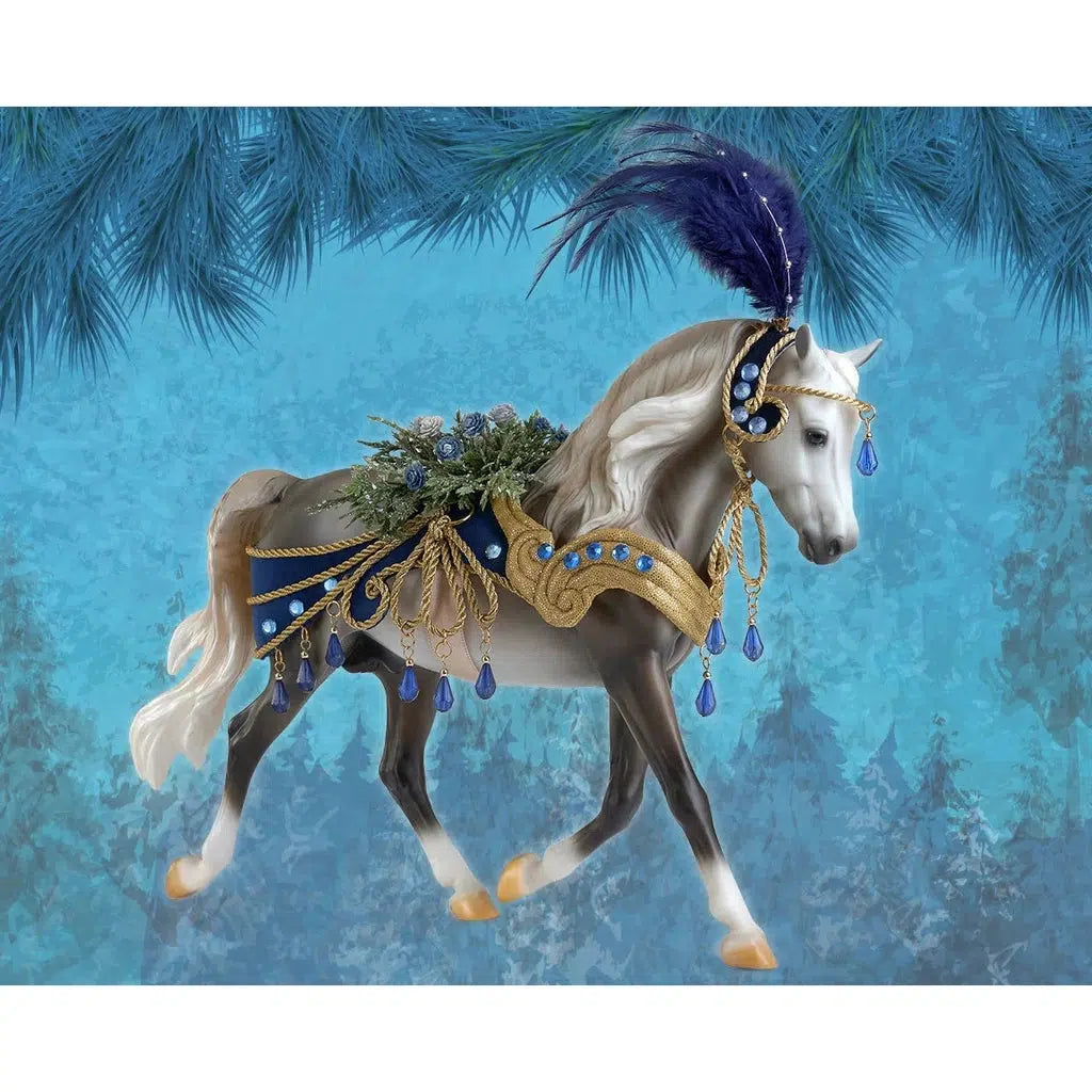 Image of the Snowbird Holiday Horse figurine. It is a grey and white horse wearing ornate navy and gold saddle and headpiece. On its back are a bundle of roses and from the headdress is a large navy feather. There are jewels dripping off of everything.