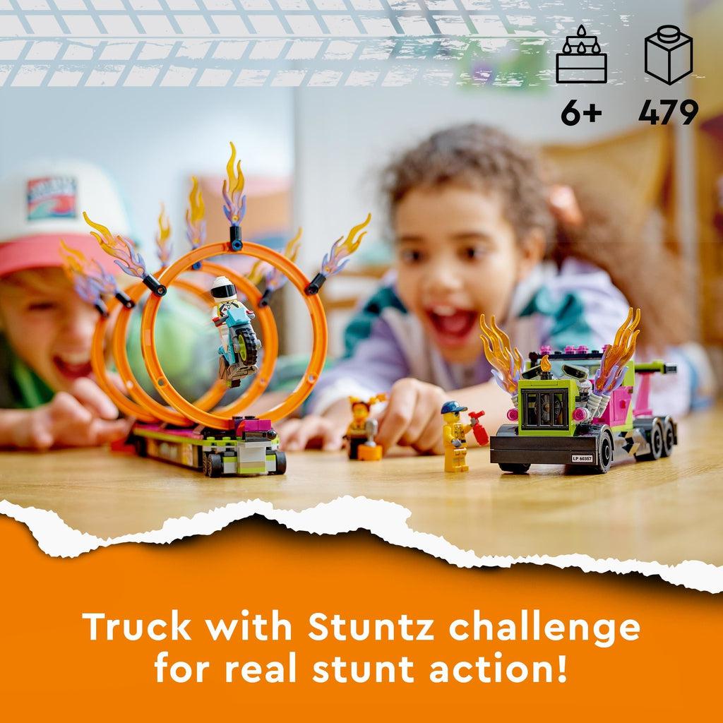 Scene of two kids excitedly playing with the LEGO playset. Recommended Age: 6+ Number of Pieces: 479 Caption: Truck with Stuntz challenge for real stunt action!