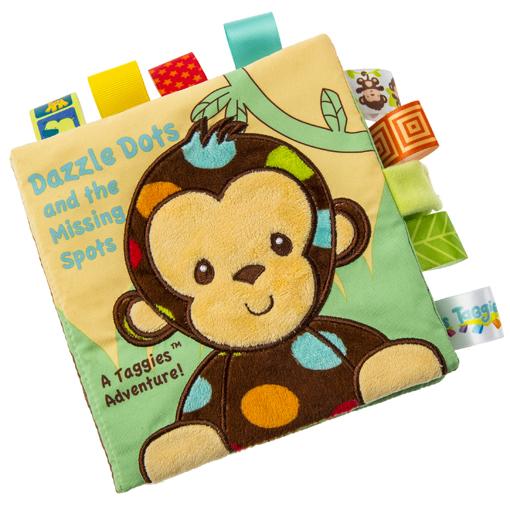 Image of the Taggies Dazzle Dots Monkey Soft Book. On the cover is an embroidered monkey with colorful spots in a jungle with the title "Dazzle Dots and the Missing Spots".