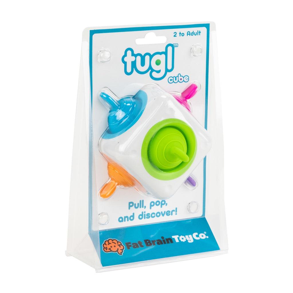 Image of the packaging for the Tugl Cube. The front is made from clear plastic so you can see the toy inside