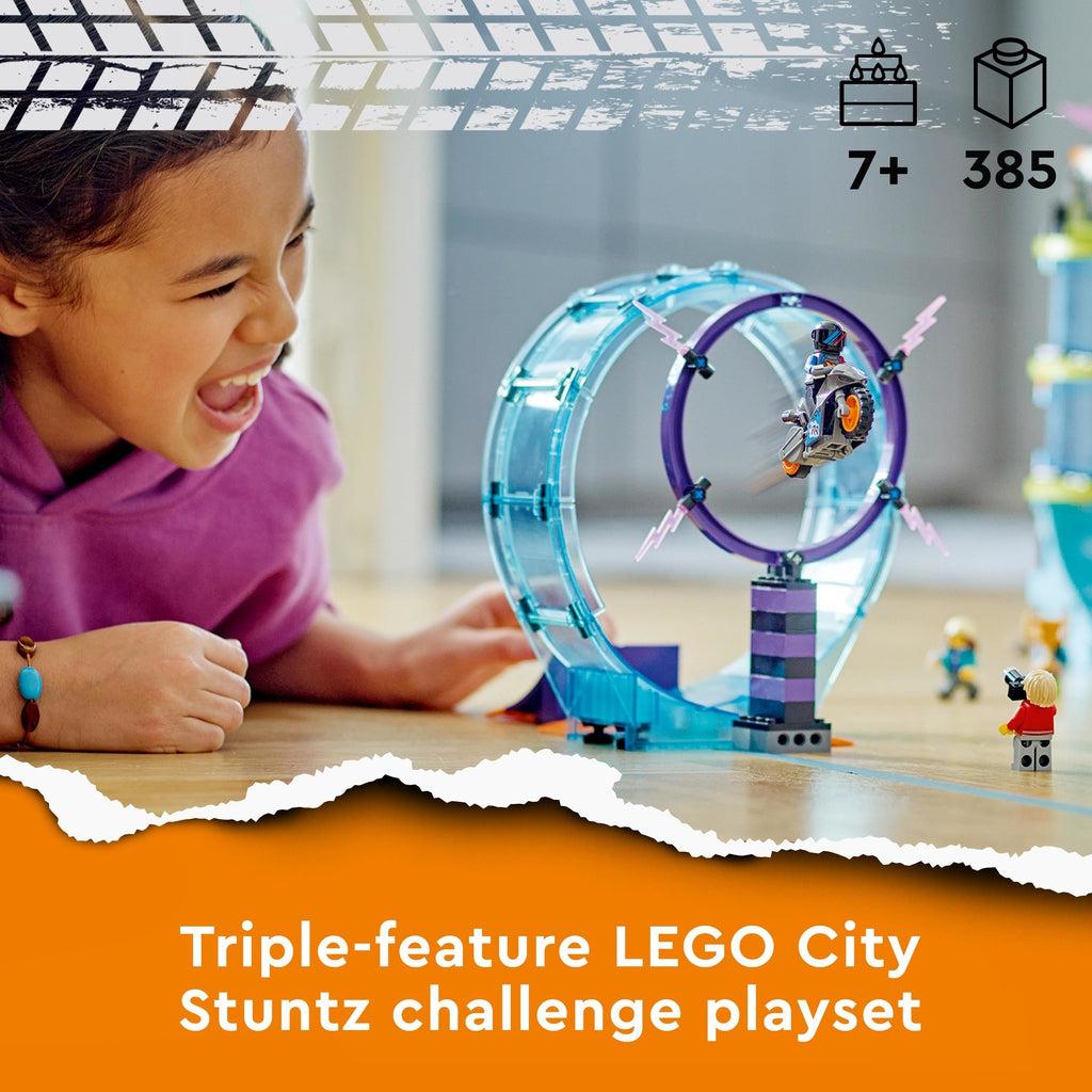 Scene of a girl excitedly playing with the playset. Recommended Age: 7+ Number of Pieces: 385 Caption: Triple-feature LEGO City Stuntz challenge playset