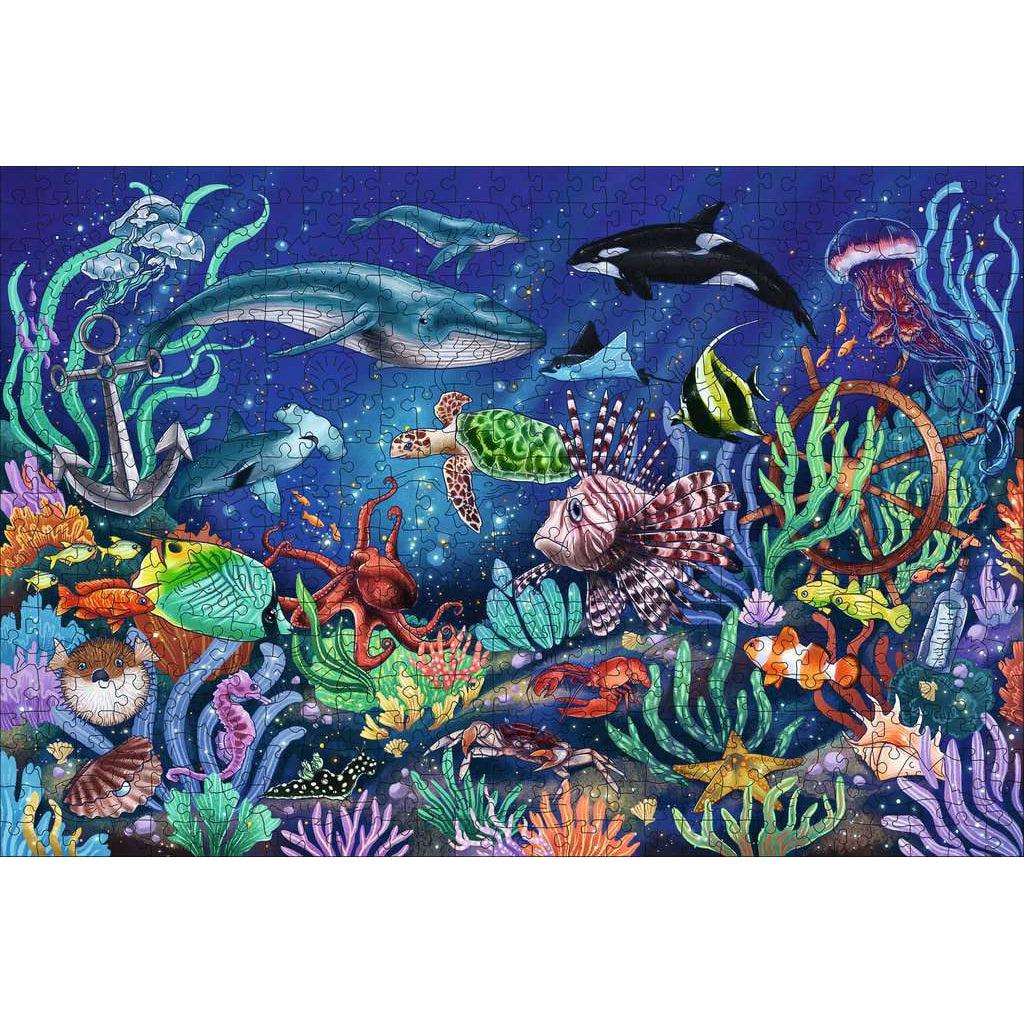 Image of the finished puzzle. It is an illustrated underwater scene of a coral reef and of many tropical fish.