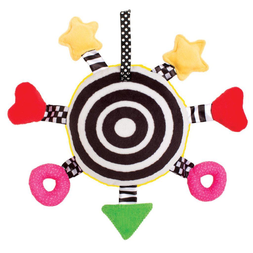 Image of the back of the toy. The back is a black and white ringed target shape on the fabric.