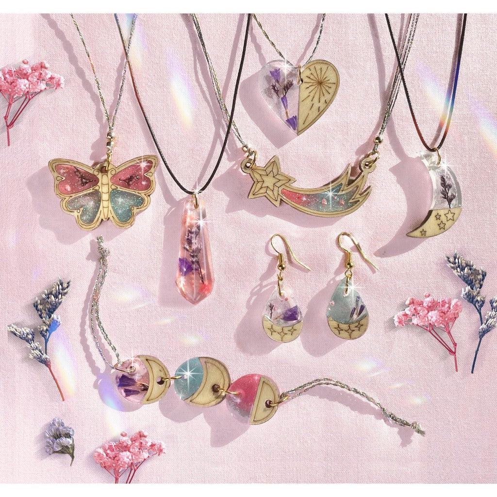 this image shows some of the resin coated charms to make, like a butterfly necklace, or some ear rings