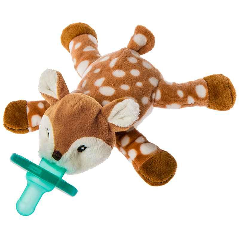 Image of the toy outside of the packaging. It is a fawn stuffed animal with a blue pacifier coming from the mouth of the fawn.