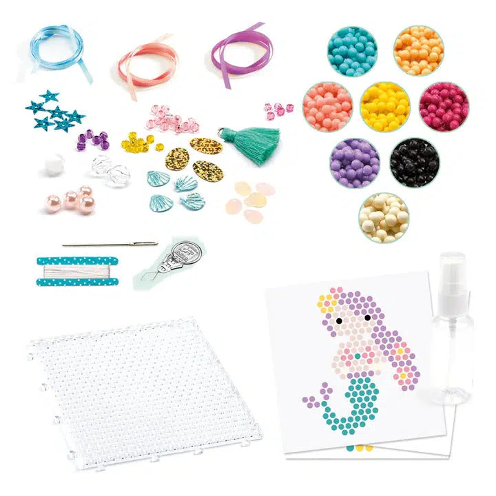 Image of all the included parts to the kit. Includes different colored beads, ribbon, charms, a needle and thread, a bead board, instructions, and a spray bottle.