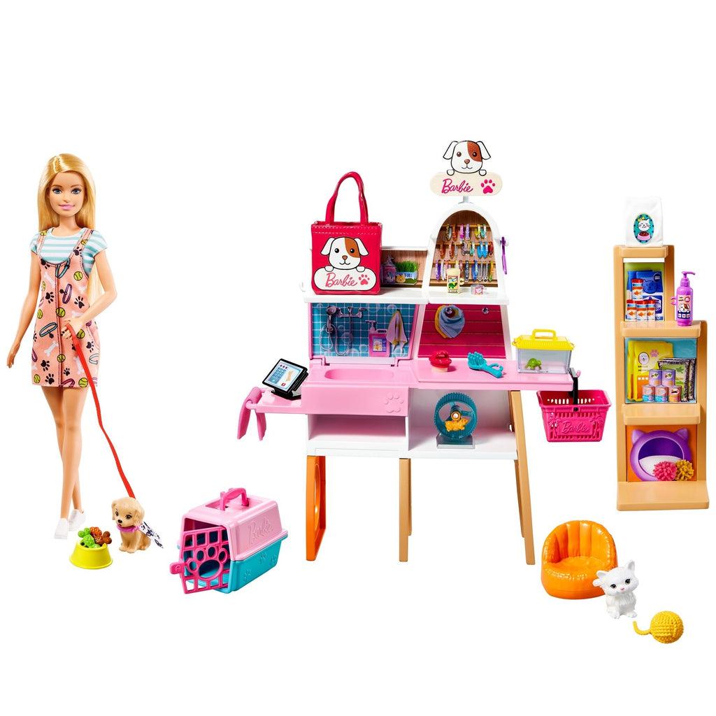 Image of all the pieces of the set put together. The set includes a Barbie doll, a pet care and grooming counter, and a standing shelf to store items.