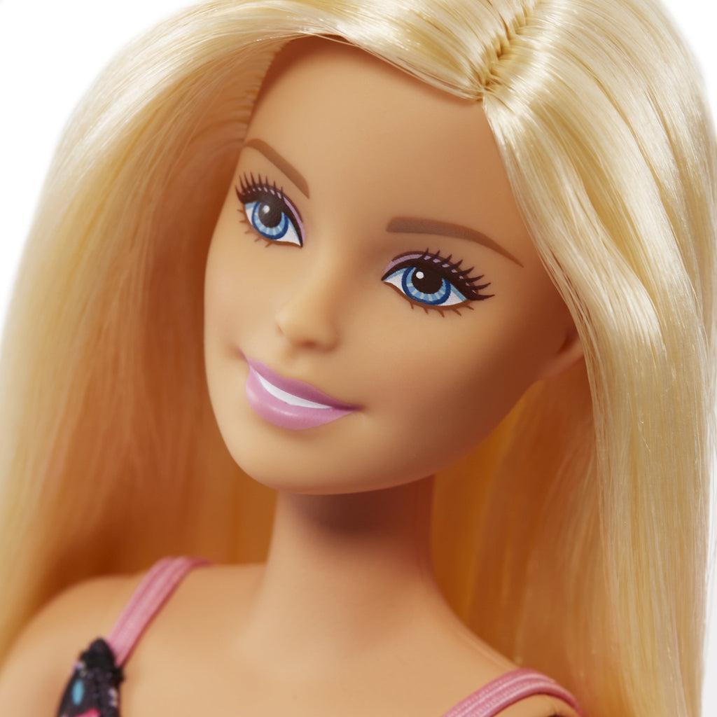 Up close shot of Barbie's face. It shows the detail of the eyes and mouth.
