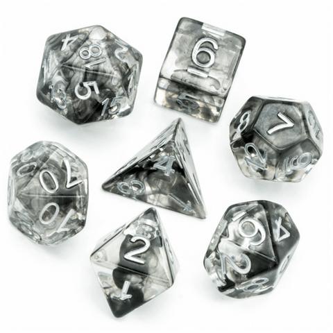 The 7 dice are shown in a circle with the D4 in the center. The dice are clear resin with black resin swirled inside like clouds or thick fog.