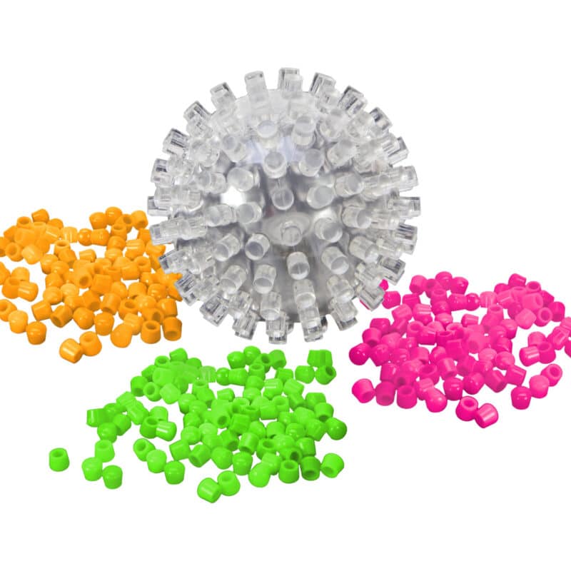 A bright ball is shown, it's a ball with many protrusions to attach caps to. a pile of caps for each of the 3 colors is shown around the ball. The ball has a slightly visible electronics inside that produce the light for the ball to glow.