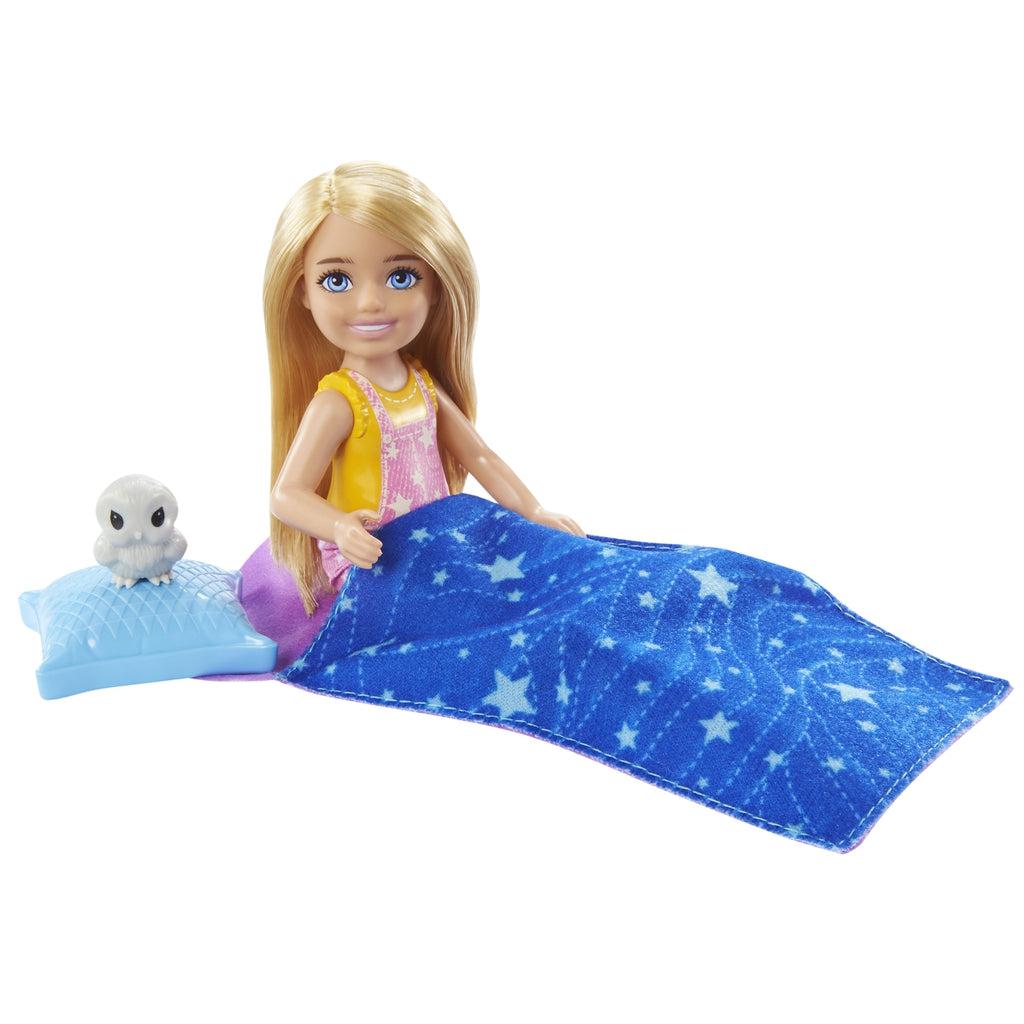 Chelsea doll inside sleeping bag with owl on pillow next to her.