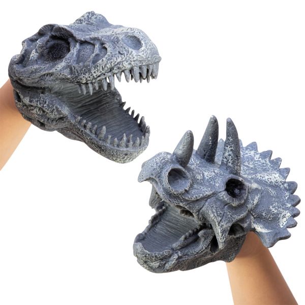 The image depicts hands wearing both versions of the dino hand puppets. The one on the left is shaped like a t-rex's skull and the one on the right is shaped like a triceratops. Both are gray with hints of white to give the appearance of slightly calcified fossils.