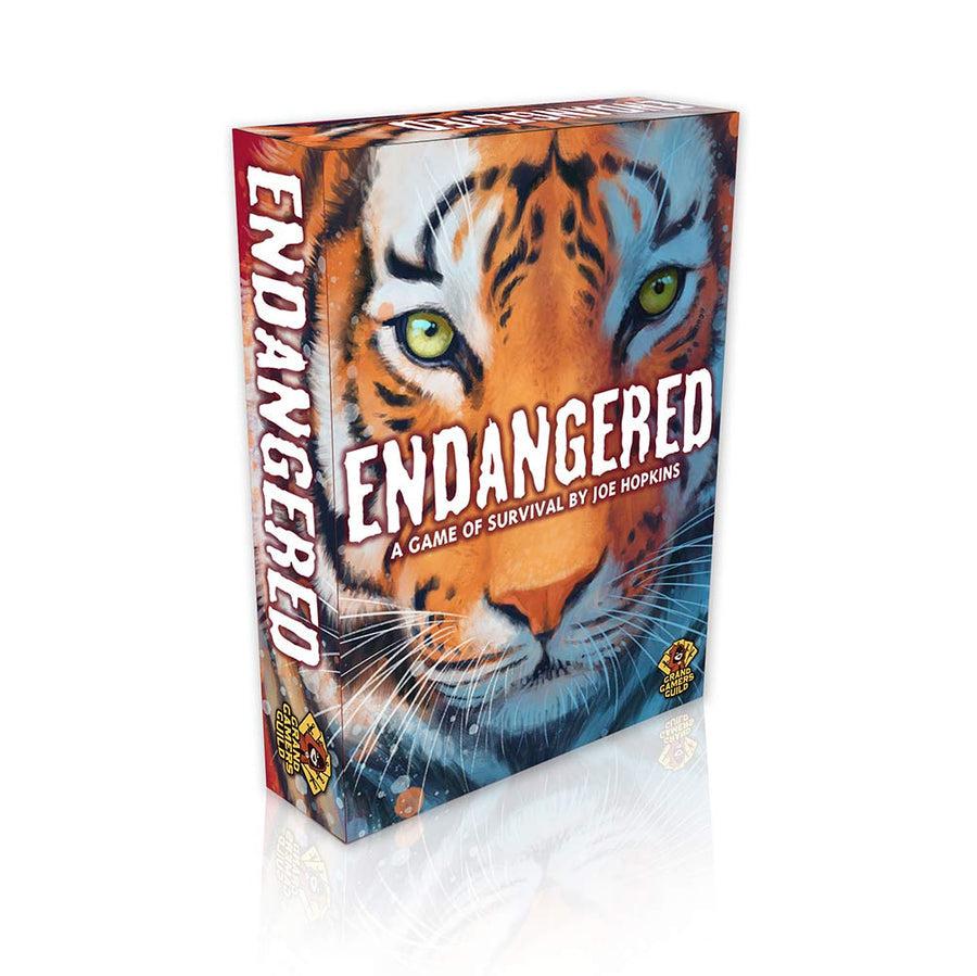 Image of the box for the game Endangered. On the front is a detailed drawing of the face of a tiger.