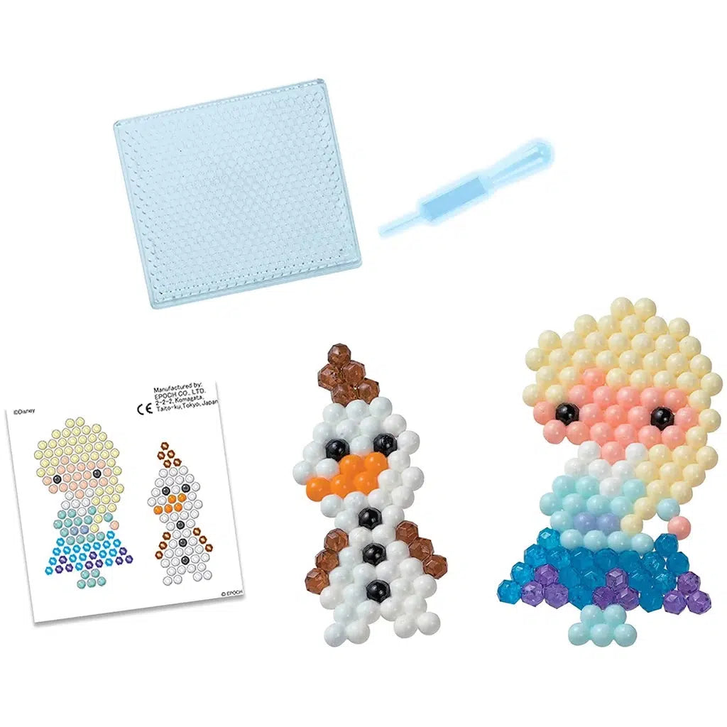 Elsa and Olaf out of packaging next to included tray for arranging the beads