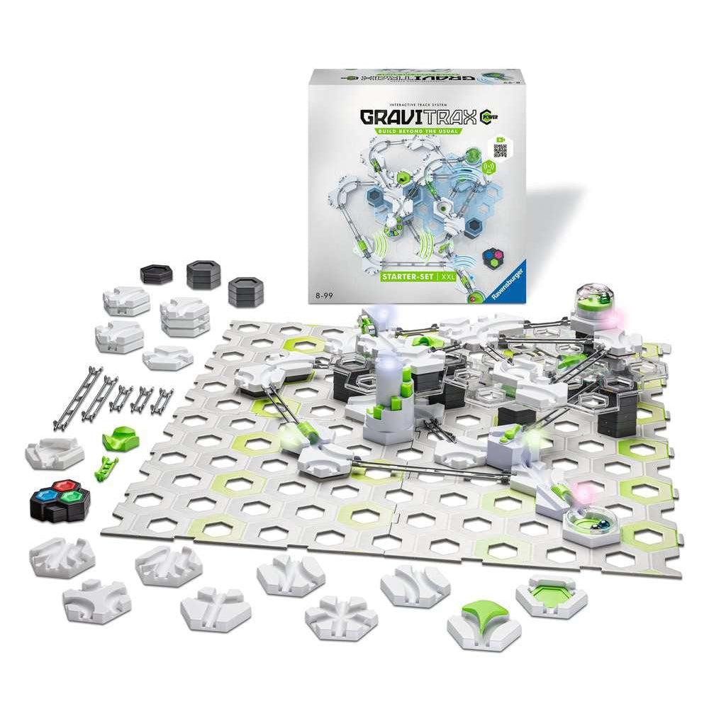 Shows all the pieces that come with the marble set. Includes the set base, marbles, metal rails, direction changers, and marble catching pieces.
