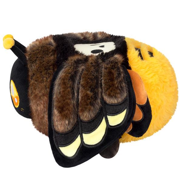Side view of the plush. Shows that it has large floppy wings.