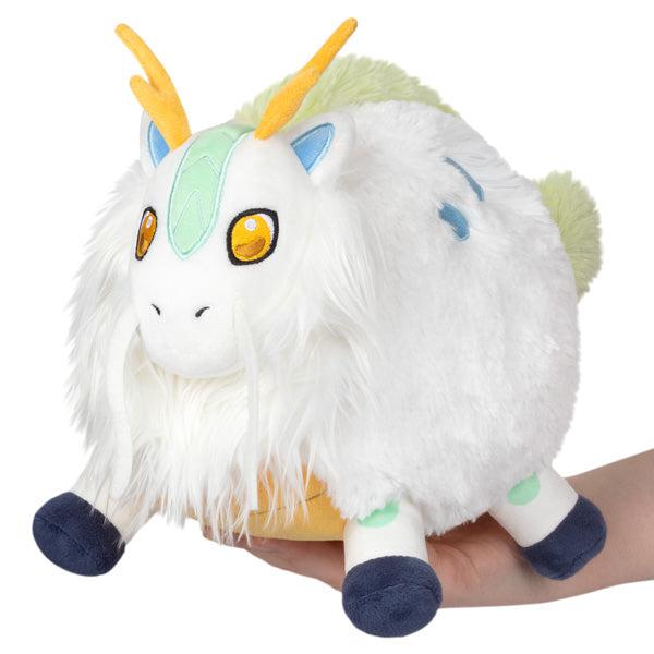 Image of the Mini Kirin squishable. It is a white forest spirit. It looks like a mix between a horse, a deer, and a dragon.