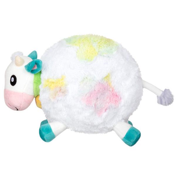 Side view of the plush. Shows that the legs and tail are sticking out of the plush.