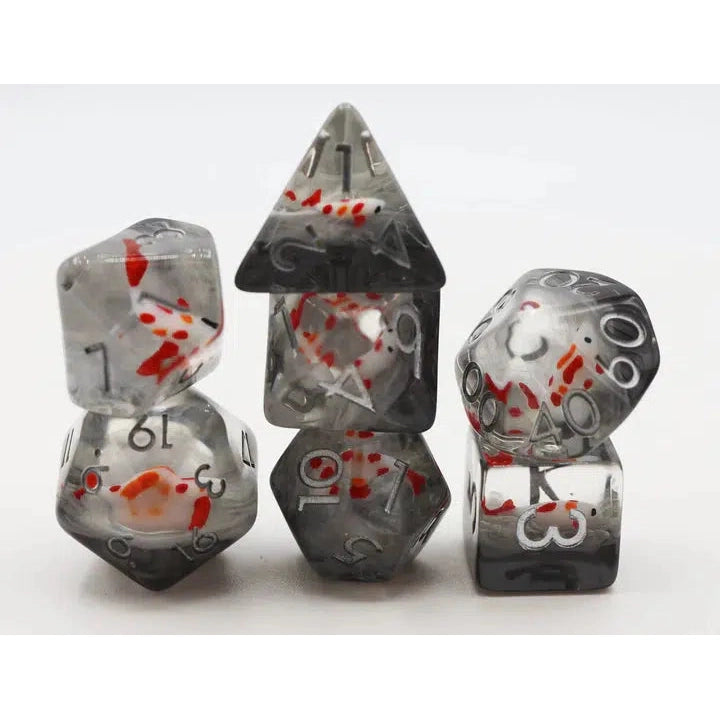 The set of dice is displayed stacked into 3 piles. Each dice is made of a cloudy but mostly clear grey resin. There are small plastic koi fish inside each.