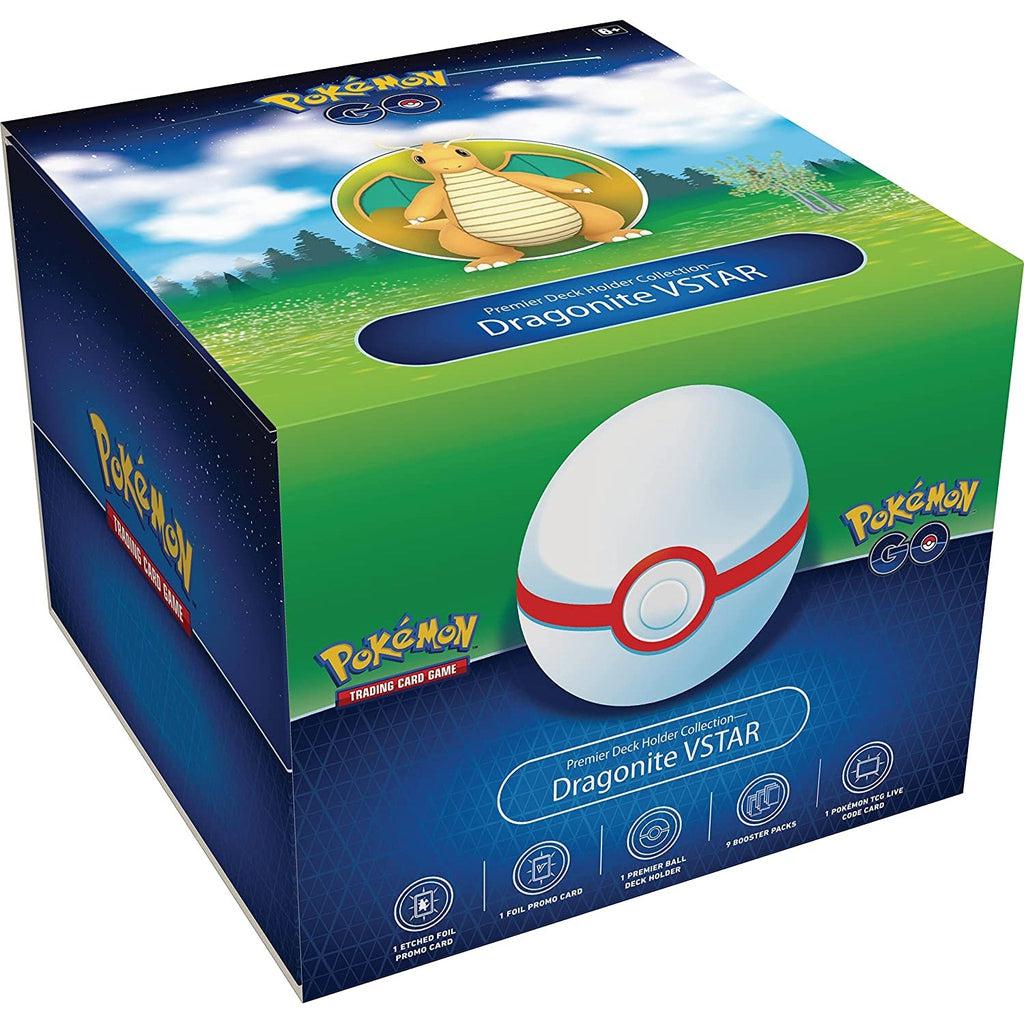 Toy packaging | Front of box has white pokeball, pokemon logos, and contents as listed. | Top of box has illustration of Dragonite pokemon against grass, treeline, and cloudy sky.
