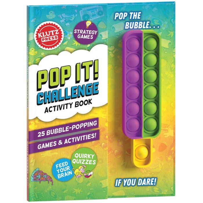 The front of the book is shown. There is a bubble popper fidget toy attached to the right side. The cover reads: Pop It challenge book, 25 games and activities, quirky quizzed, feed your brain, and finally the text: Pop the bubble... if you dare, is written next to the bubble popper