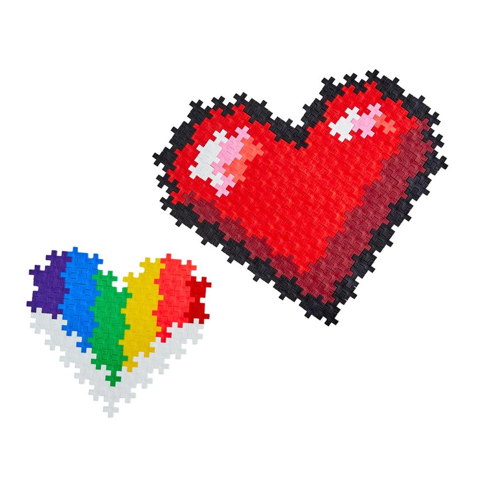 Constructed puzzles | One large red heart with black outline | One small rainbow heart with white detailing